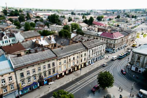 city high angle view of cars on road between buildings building